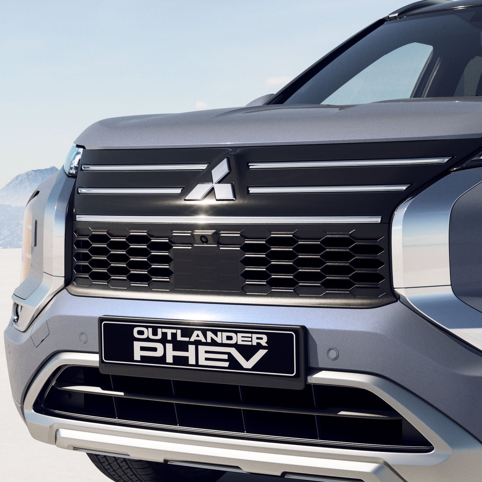 Voorzijde van de Mitsubishi Outlander PHEV met Mitsubishi-logo
